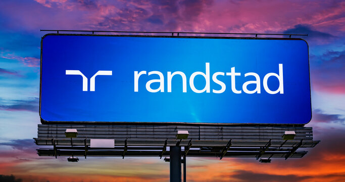 Advertisement billboard displaying logo of Randstad