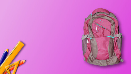 back to school background with pink school bag and school tools