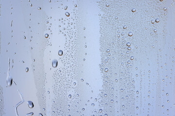 drops glass blue background abstract, transparent cold background water splashes