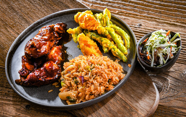 Chicken thighs in tamarind sauce with tom yum wok fried rice