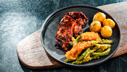 Chicken thighs in tamarind sauce with veggies tempura and potato