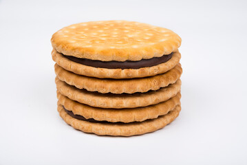 Crispy sandwich biscuits with fluffy cream on a white