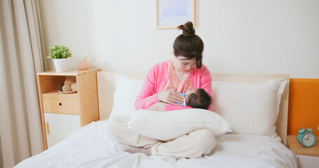 asian mother breastfeeding baby