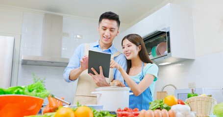 Obraz na płótnie Canvas cooking recipe on digital tablet
