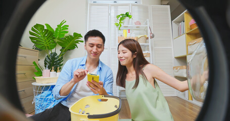 couple using phone control laundry