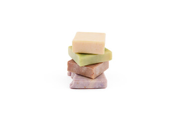 Handmade soap bars with organic ingredients on white background. Homemade beauty products with natural essential oils from plants and flowers. Body care, aromatherapy.