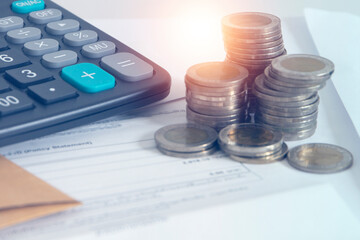 Business data and Financial analytics Concept , pile of coins and calculator