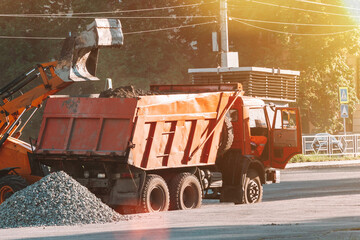 Road works. Workers repair the asphalt pavement of the road. 