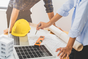 Construction of engineer, architect young businessman, colleague male hand in use pen point to...