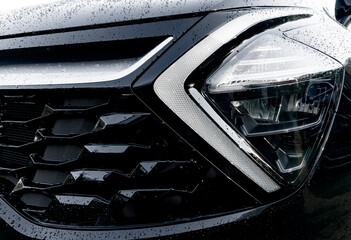 Radiator grille pattern. Car radiator grill close up with water drops. Chrome grill of big powerful...