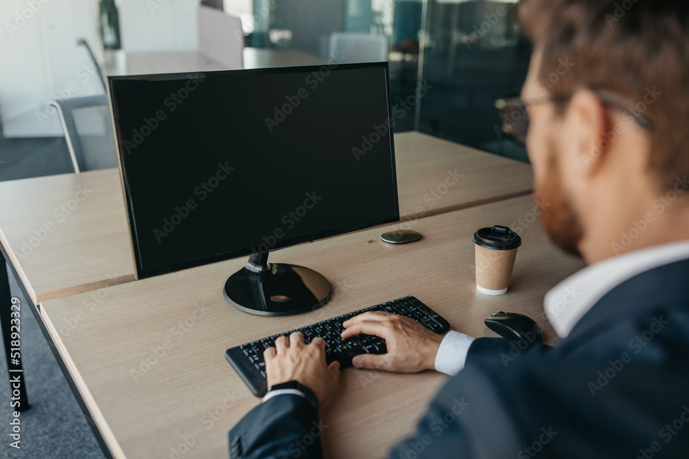 Aufkleber unrecognizable businessman using computer with empty screen at office, sitting at workplace, offerin