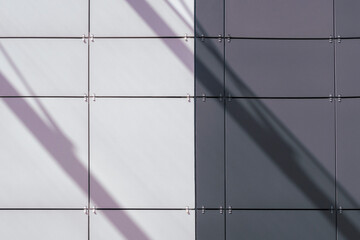 White and gray tile surface with diagonal shadows. Geomeric background