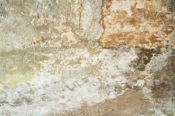 old wall covered with abstract cracked plaster