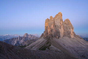 Stunning view of the Three Peaks of Lavaredo, (Tre cime di Lavaredo) during a beautiful sunrise. The Three Peaks of Lavaredo are the undisputed symbol of the Dolomites, Italy.