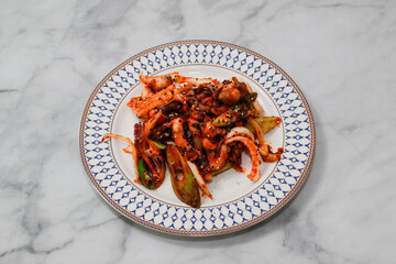 Stir-fried Octopus on bright background.