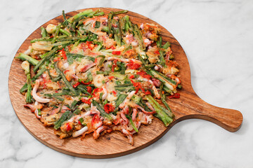 Seafood and Green Onion Pancake on bright background.