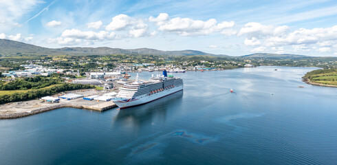 Aerial view of Killybegs with huge cruise ship in County Donegal - Ireland - All brands and logos...