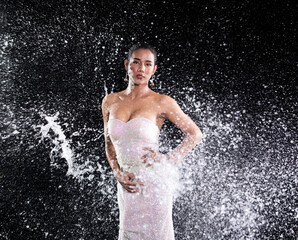 Obraz premium Young 20s Asian Woman wear Evening sequin ball Gown with water splash throw to back model