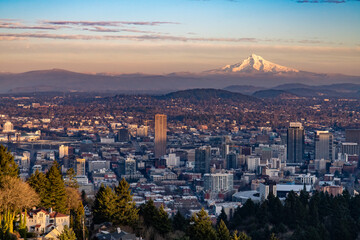 The city of Portland at sunset, as seen toward east and Mt. Hood towering oil the background