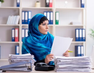 Female employee in hijab working in the office