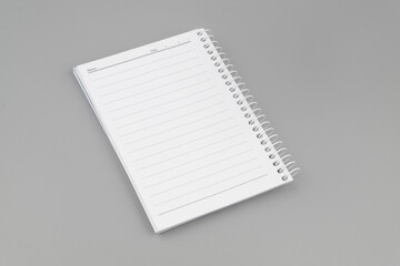 Open blank notebook or organizer on gray background	