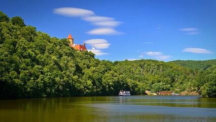 Beautiful old castle Veveri. Landscape with water on the Brno dam during summer holidays on a sunny day. Czech Republic - Brno.