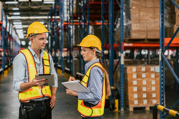 cargo warehouse professional working people caucasian male and woman talking together engineer...