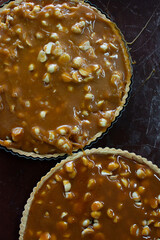 Preparing a macadamia pie with toffee. Kneading and baking of a cake. Pastry and pastry.