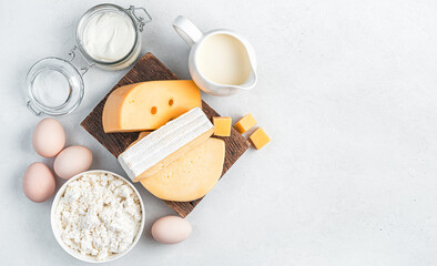 Fototapeta na wymiar Fresh dairy products on a gray background. Top view, copy space