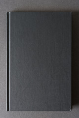 isolated black cover book on a dark gray background