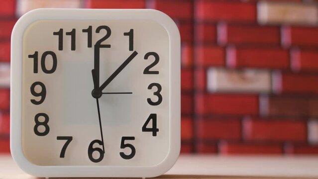 Time lapse, square clock face on brick background, with place for copy space
