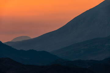 Fototapeta na wymiar Gjirokaster, Albania A sunset view over the mountains.
