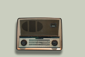 Old transistor radio receiver isolated background.