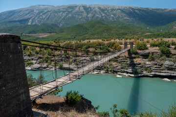 Permet, Albania A crumbling wooden and steel footbridge bridge over the Vjosa river