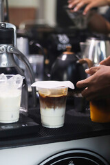 pouring coffee into a cup