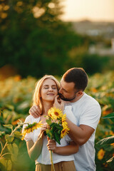 People spend time in a sunflowers field