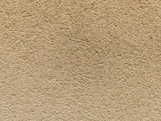 Perfect background shot for designers of a beautiful unique beige brown wall without cracks