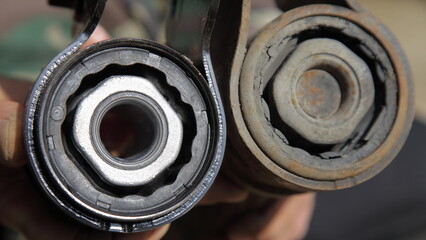 New and old broken silent blocks with metall sleeves close up