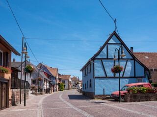 blue wall on half timbered house in ferench village in vosges area