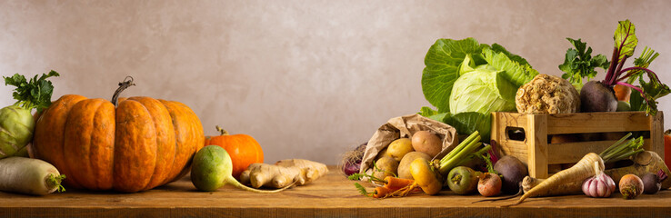 Autumn harvest of different vegetables. Still life of food on wooden table. Concept healthy food.