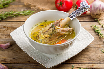 shurpa asian soup with meat and vegetables on old wooden table