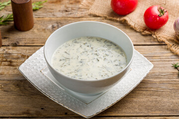 dovga soup on white bowl on wooden table