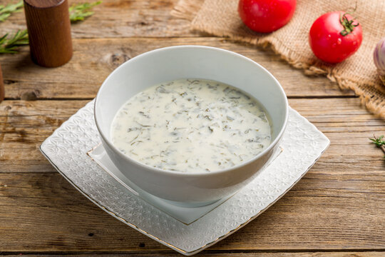 dovga soup on white bowl on wooden table