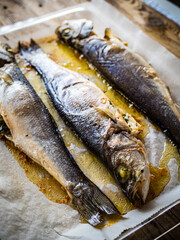 Roast perch on glass cooking pan