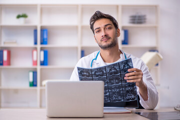 Young male doctor radiologist working in the clinic