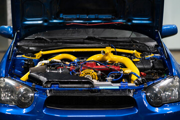 beautiful turbo sport car engine bay with yellow pipes