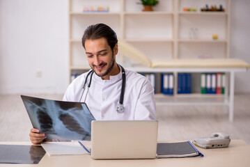 Young male doctor radiologist working in the clinic