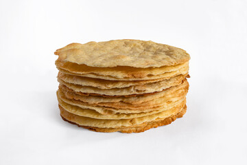 Stack of baked cake layers isolated on white. Cooking multilayer cake Napoleon