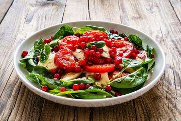 Mozzarella salad on wooden table
