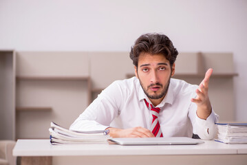 Young male employee working from home during pandemic